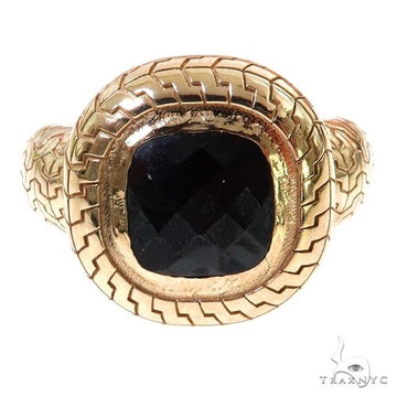 Yellow gold men's ring with a large faceted black garnet and patterned band.