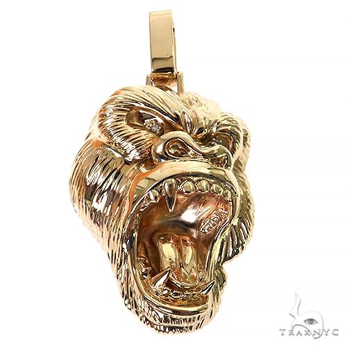 Custom gold gorilla pendant in 14k yellow gold – detailed sculptural figure, front-facing angle