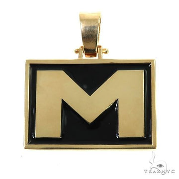 Yellow gold rectangular pendant with black enamel background and bold initial M.
