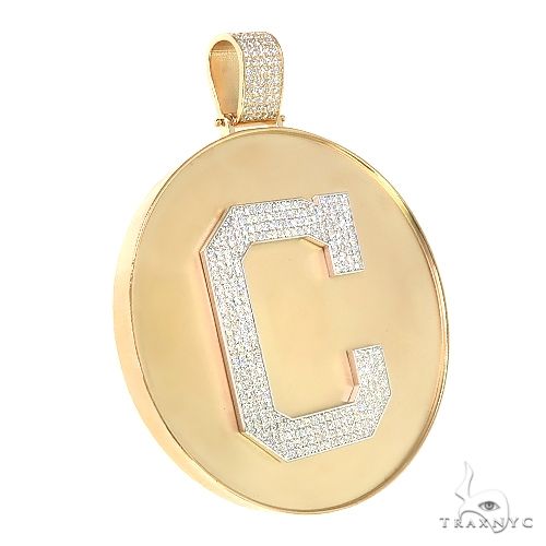 Yellow gold medallion pendant with diamond-encrusted initial "C" and pavé bail