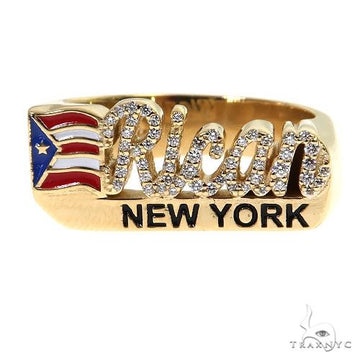 Yellow gold ring with encrusted diamonds spelling "Rican" and Puerto Rican flag detail.