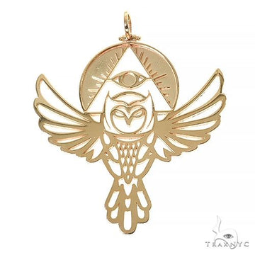 Gold owl pendant with outstretched wings and all-seeing eye above in intricate design.