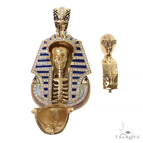 Gold pharaoh pendant with blue enamel and interchangeable skull and alien body parts inside