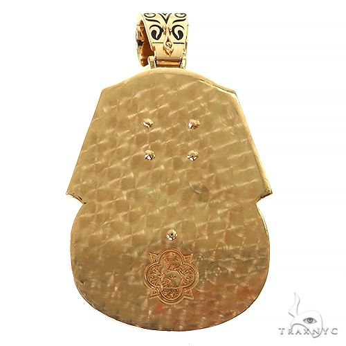 Yellow gold pharaoh pendant with textured surface and engraved Egyptian design detail