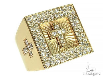 Yellow gold pinky ring with diamond-studded cross and sparkling diamond border.