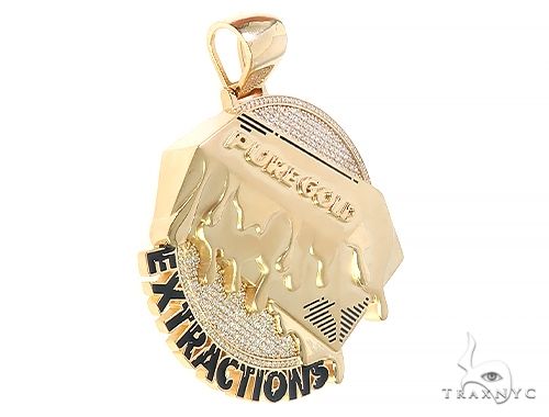 Yellow gold pendant with raised text "PURE GOLD EXTRACTIONS" and diamond accents