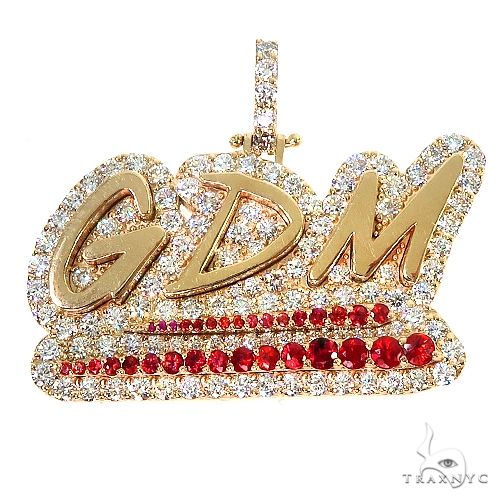 Custom red sapphire and diamond pendant, front view showing round-cut diamond and red sapphire cluster setting