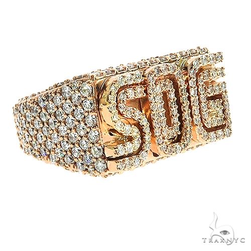 Rose gold custom pinky ring with diamond-encrusted "SOG" lettering and pavé diamond band