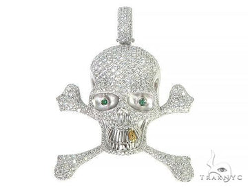 Custom diamond skull pendant in 14k gold — diamonds set in eye sockets and across the cranial surface, front-facing angle