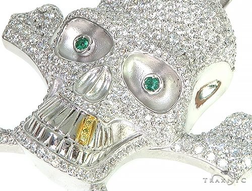 White gold skull pendant with diamonds and emerald eyes, detailed craftsmanship