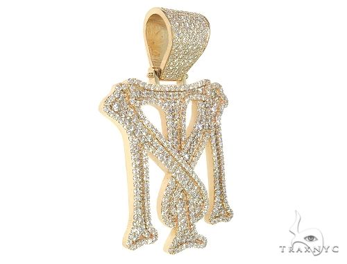 Large custom yellow gold pendant shaped as "TM" encrusted with sparkling diamonds