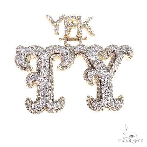 Custom 'TY' initial diamond pendant in 14k gold with prong-set diamonds, front-facing view