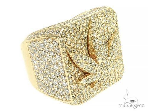 Yellow gold custom men’s pinky ring with detailed weed leaf design and textured surface
