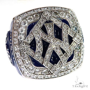 Yellow gold Yankees championship ring with diamond-encrusted logo and blue enamel accents.