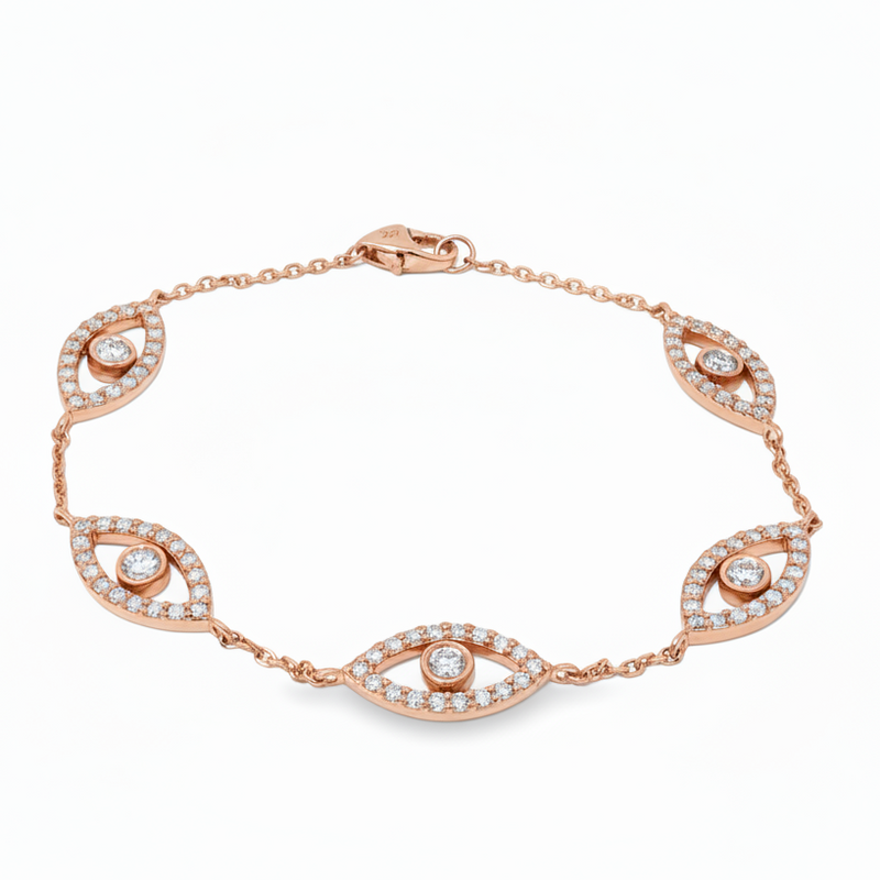 White gold evil eye bracelet with five diamond-accented eye charms and delicate chain links.