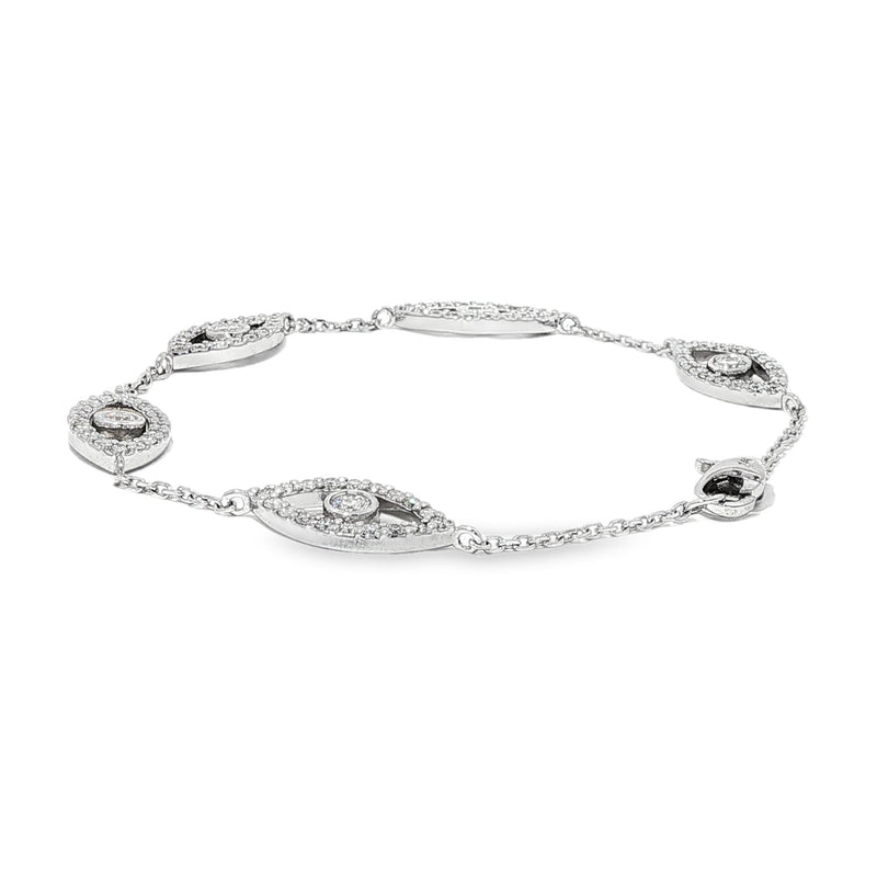 White gold evil eye bracelet with five diamond-accented eye charms and delicate chain links.