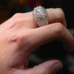 Yellow gold men’s ring with large diamond cluster and pavé diamond detailing.