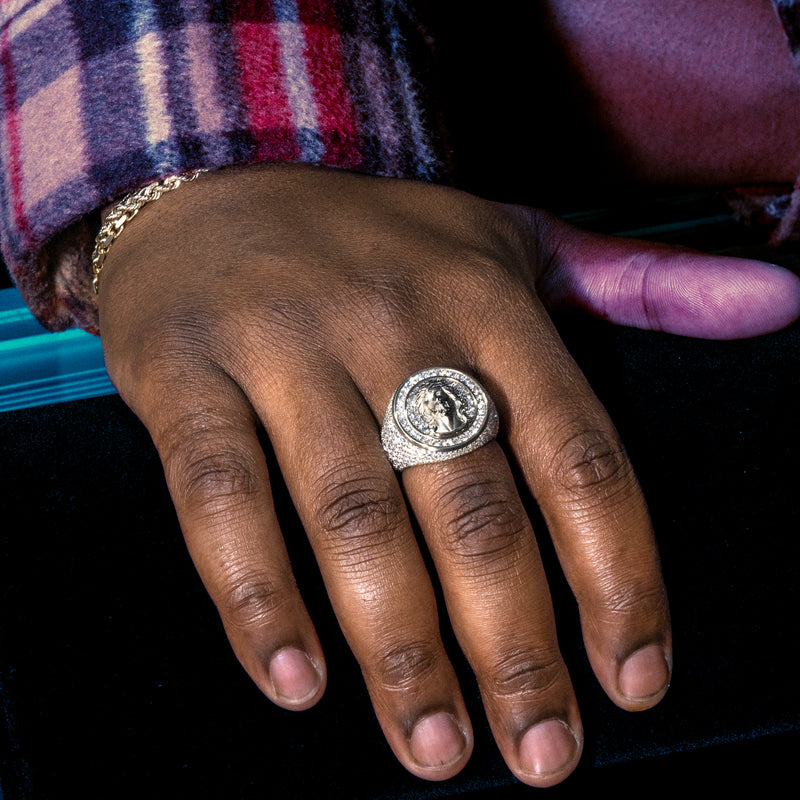 Gold circular men's ring with Jesus head and diamond accents in concentric circles.