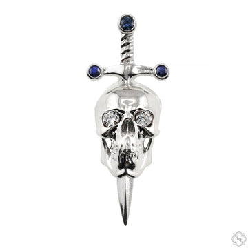 Silver skull pendant with sword and blue gemstone accents.