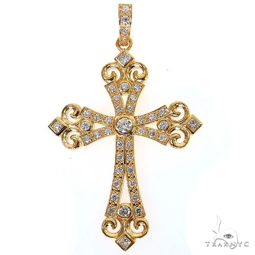Yellow gold diamond cross pendant with intricate scrollwork and round-cut diamonds