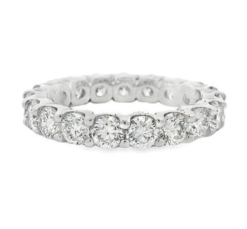 White gold diamond eternity band with round brilliant-cut diamonds in a continuous circle.