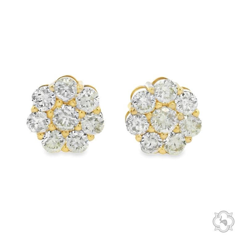 Large yellow gold flower cluster earrings with white diamond petals and center stones