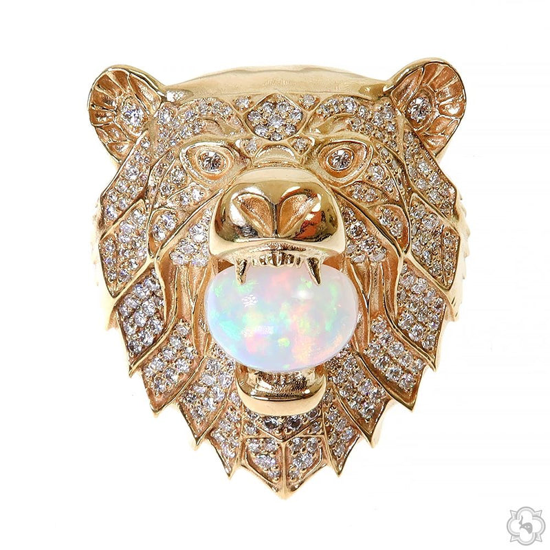 Yellow gold grizzly bear ring with diamonds and a large opal gemstone in the mouth