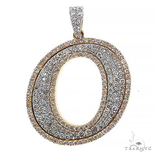 Oval-shaped initial pendant encrusted with sparkling diamonds in gold setting
