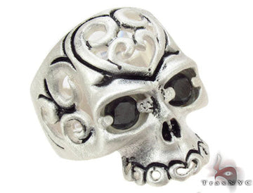 Men's silver skull ring with detailed engraving and diamond accents