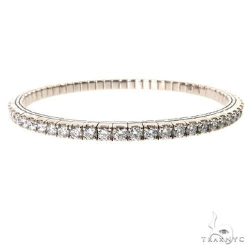 White gold diamond stretch bangle bracelet with round-cut tennis diamonds.
