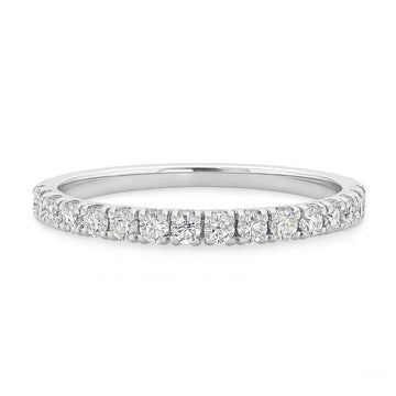 1.6mm white gold diamond wedding band with small round-cut diamonds.