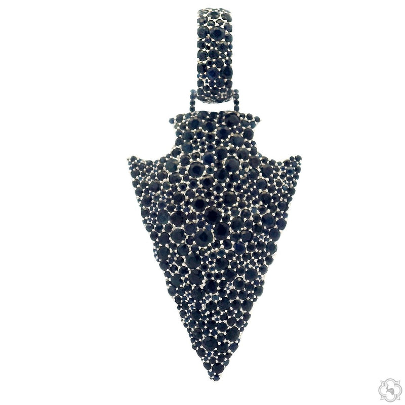 Double-sided silver arrowhead pendant with black gemstone accents and textured design