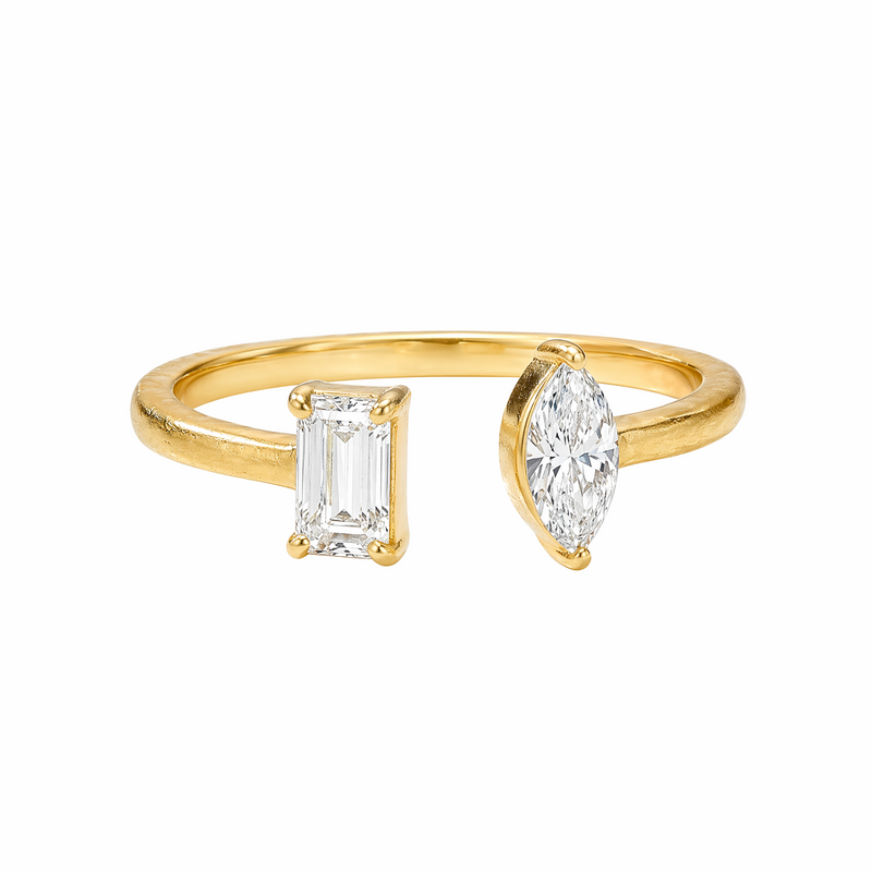 Yellow gold open ring with emerald and marquise cut diamonds on each end.