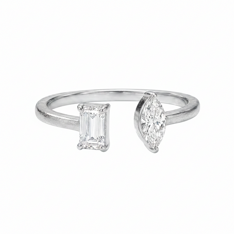 White gold open ring with emerald-cut and marquise diamonds on each end.