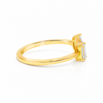 Delicate gold open ring with two baguette-cut diamonds set side by side.