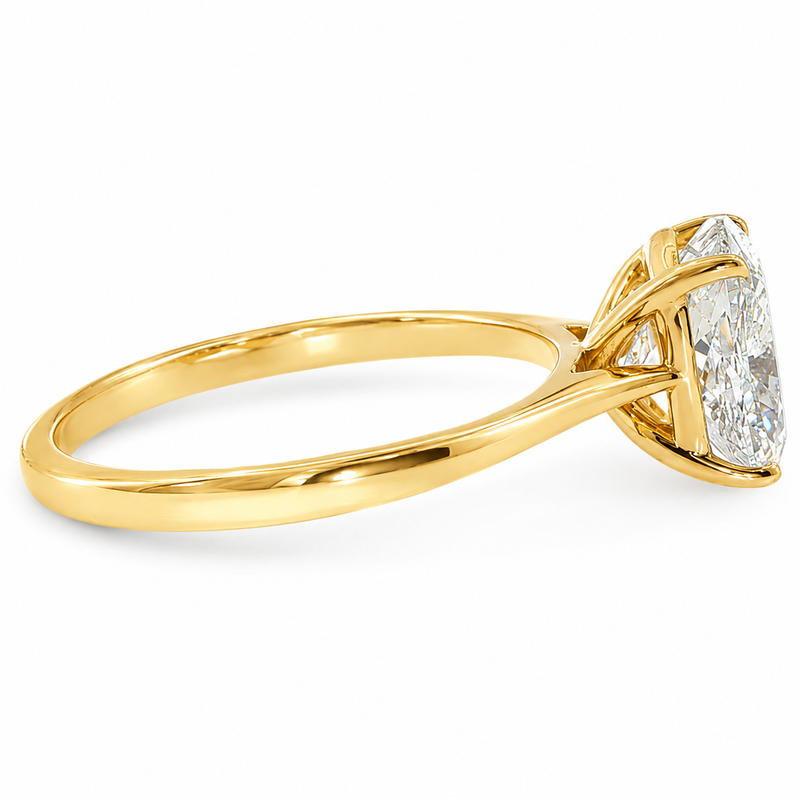 14K gold elongated cushion lab grown diamond engagement ring with a 2.50 carat center stone, four-prong cathedral setting, and slim 2.00mm band.