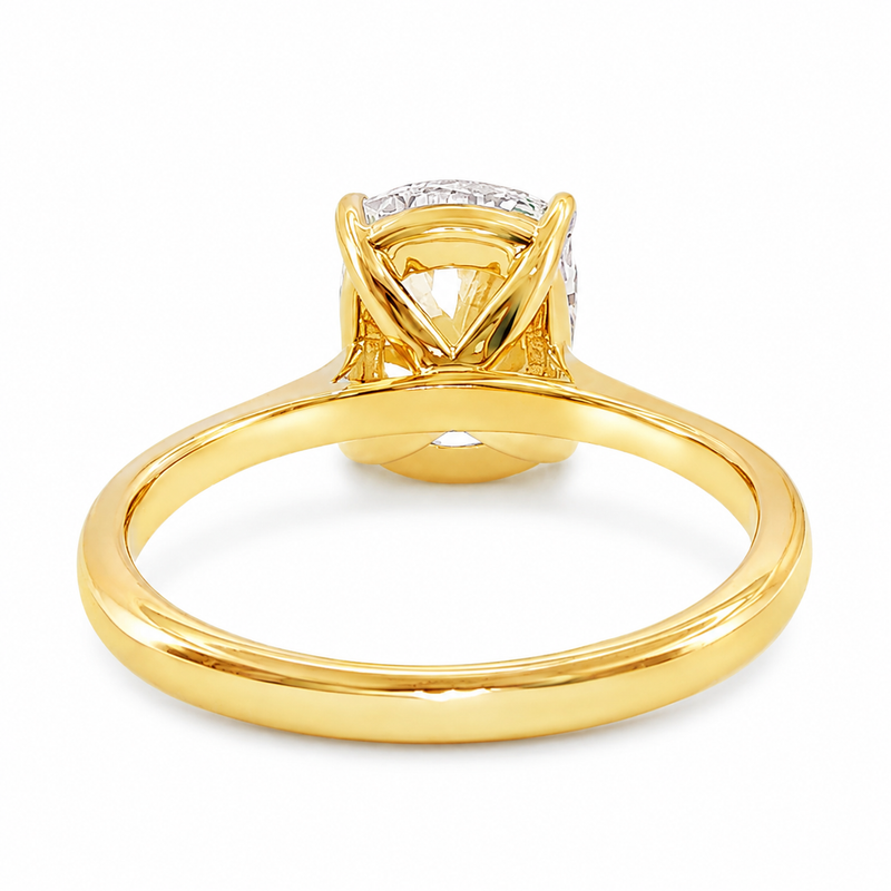 14K gold elongated cushion lab grown diamond engagement ring with a 2.50 carat center stone, four-prong cathedral setting, and slim 2.00mm band.