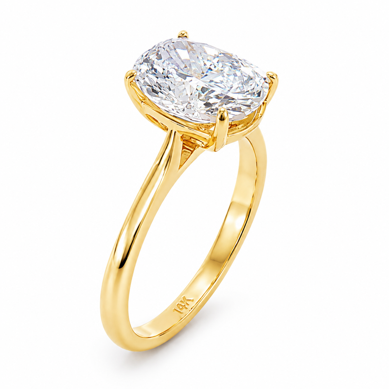14K gold elongated cushion lab grown diamond engagement ring with a 2.50 carat center stone, four-prong cathedral setting, and slim 2.00mm band.