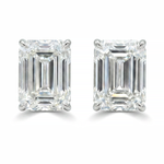 Pair of emerald cut diamond stud earrings with four-prong white gold setting
