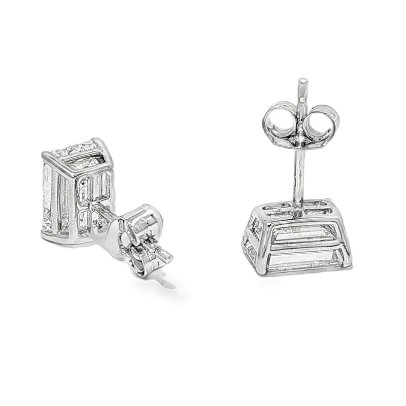 Pair of emerald cut diamond stud earrings with four-prong white gold setting