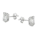 Pair of emerald cut diamond stud earrings with four-prong white gold setting