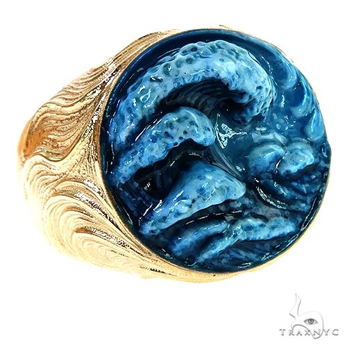 Yellow gold ring with textured waves and glossy blue enamel detailing on top