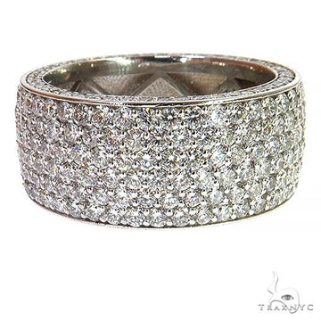 Wide white gold eternity ring with multiple rows of round cut diamonds.