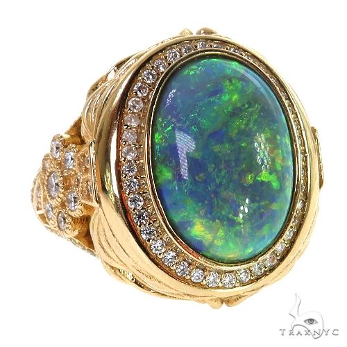 Yellow gold ring with large Ethiopian opal and diamond halo on textured band