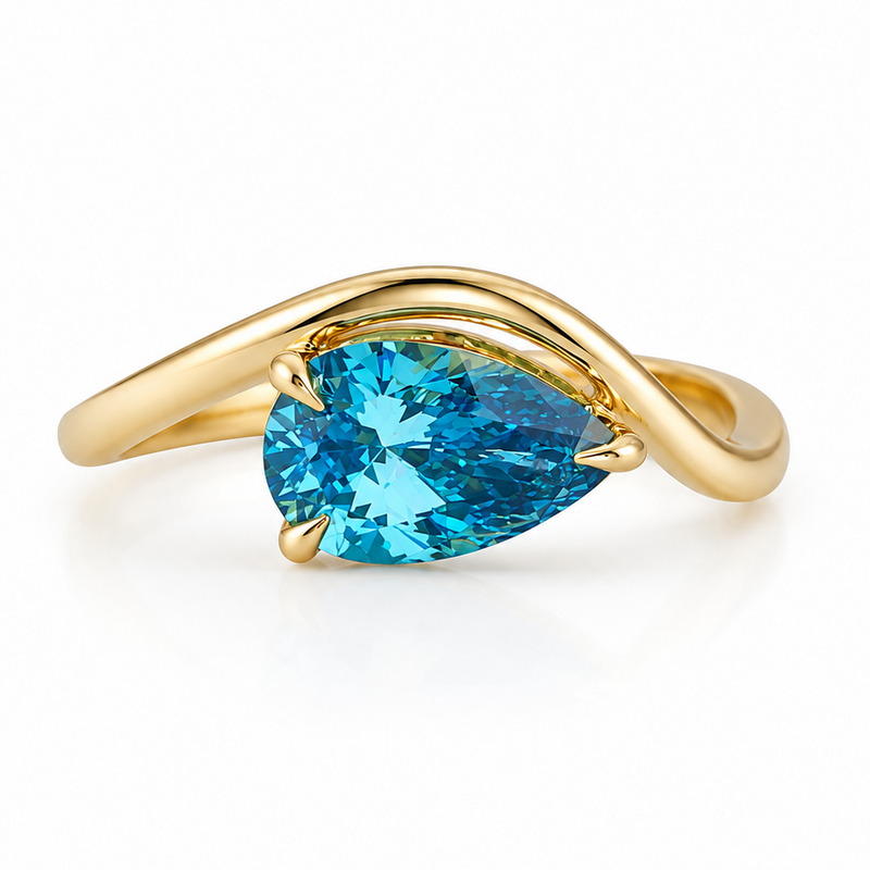Yellow gold ring with pear-shaped vivid blue diamond solitaire center stone