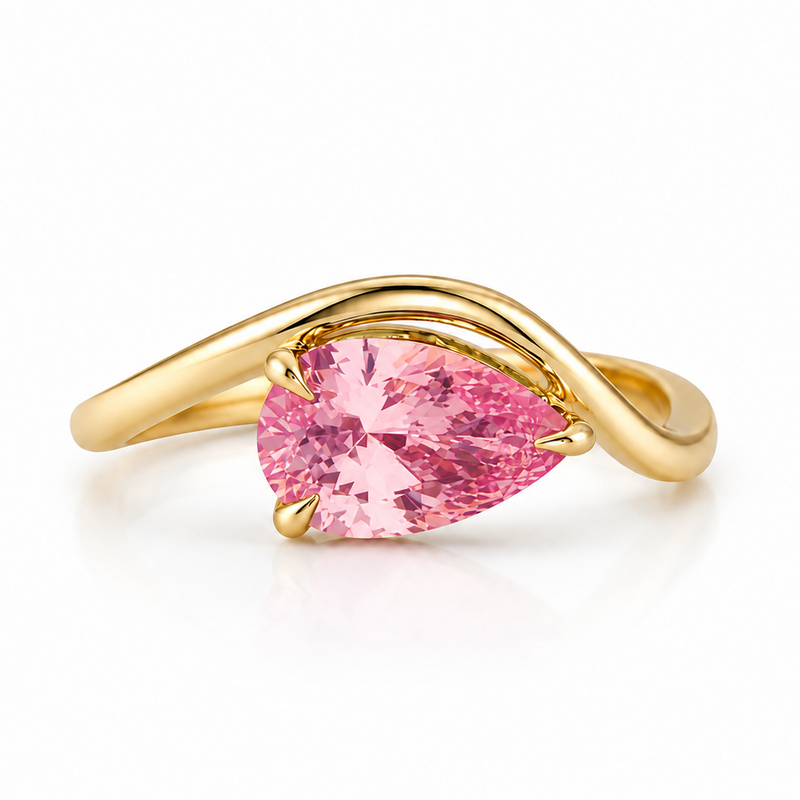 Yellow gold ring with pear-shaped fancy vivid pink diamond center stone and twisting band