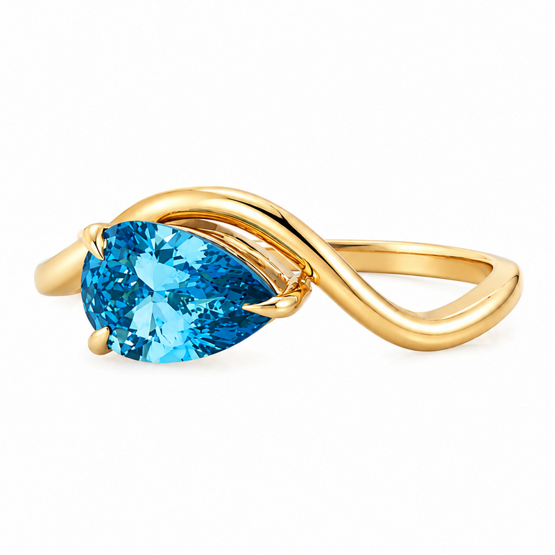 Yellow gold ring with pear-shaped vivid blue diamond and elegant twist band design