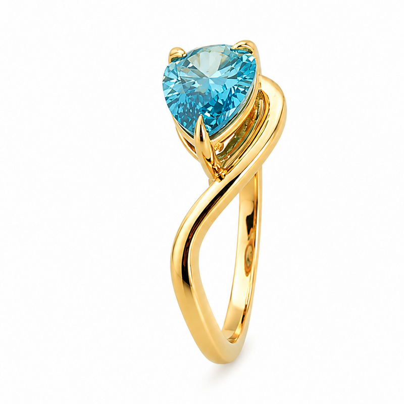 Yellow gold ring with a pear-shaped vivid blue diamond solitaire in a twist setting