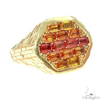 Yellow gold hexagon ring with vertically set orange and red sapphire baguettes.