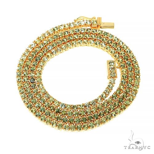 Forest green sapphire tennis chain in 14k gold – continuous prong-set stone row, front view